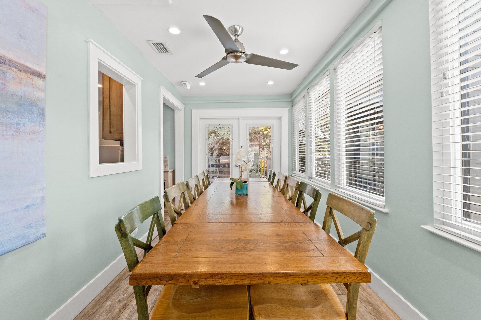 91 Cypress Hill Road Santa Rosa Beach, FL 32459 - Photo 36 of 66 a dining room with wooden floor and a chandelier