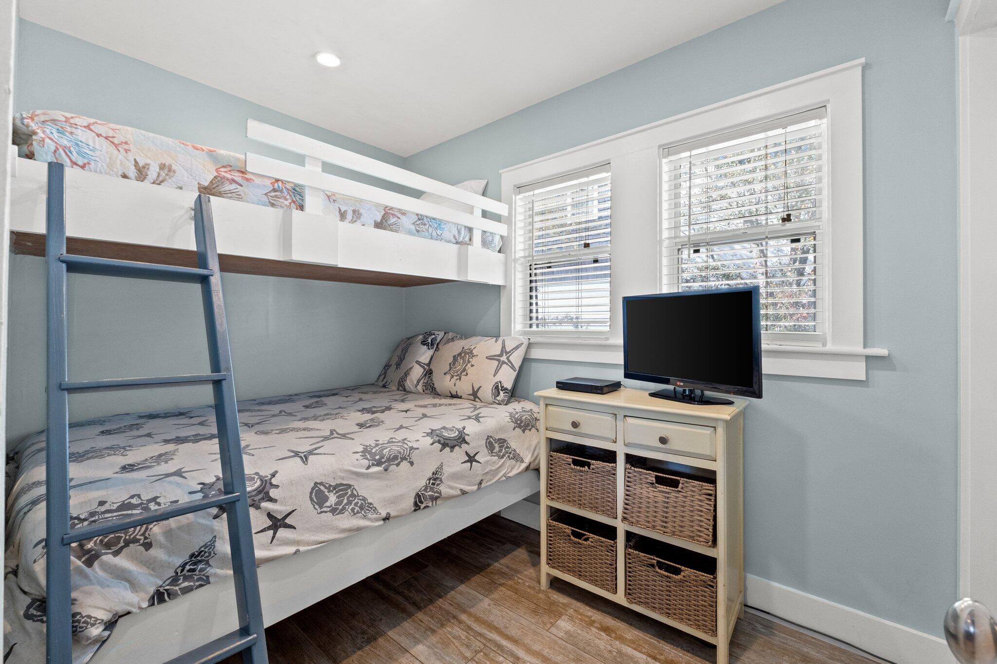 91 Cypress Hill Road Santa Rosa Beach, FL 32459 - Photo 38 of 66 a bedroom with a bed and a flat screen tv