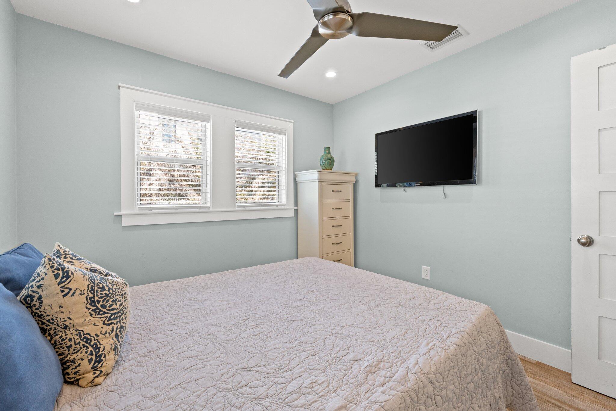 91 Cypress Hill Road Santa Rosa Beach, FL 32459 - Photo 43 of 66 a bedroom with a large bed and a flat screen tv