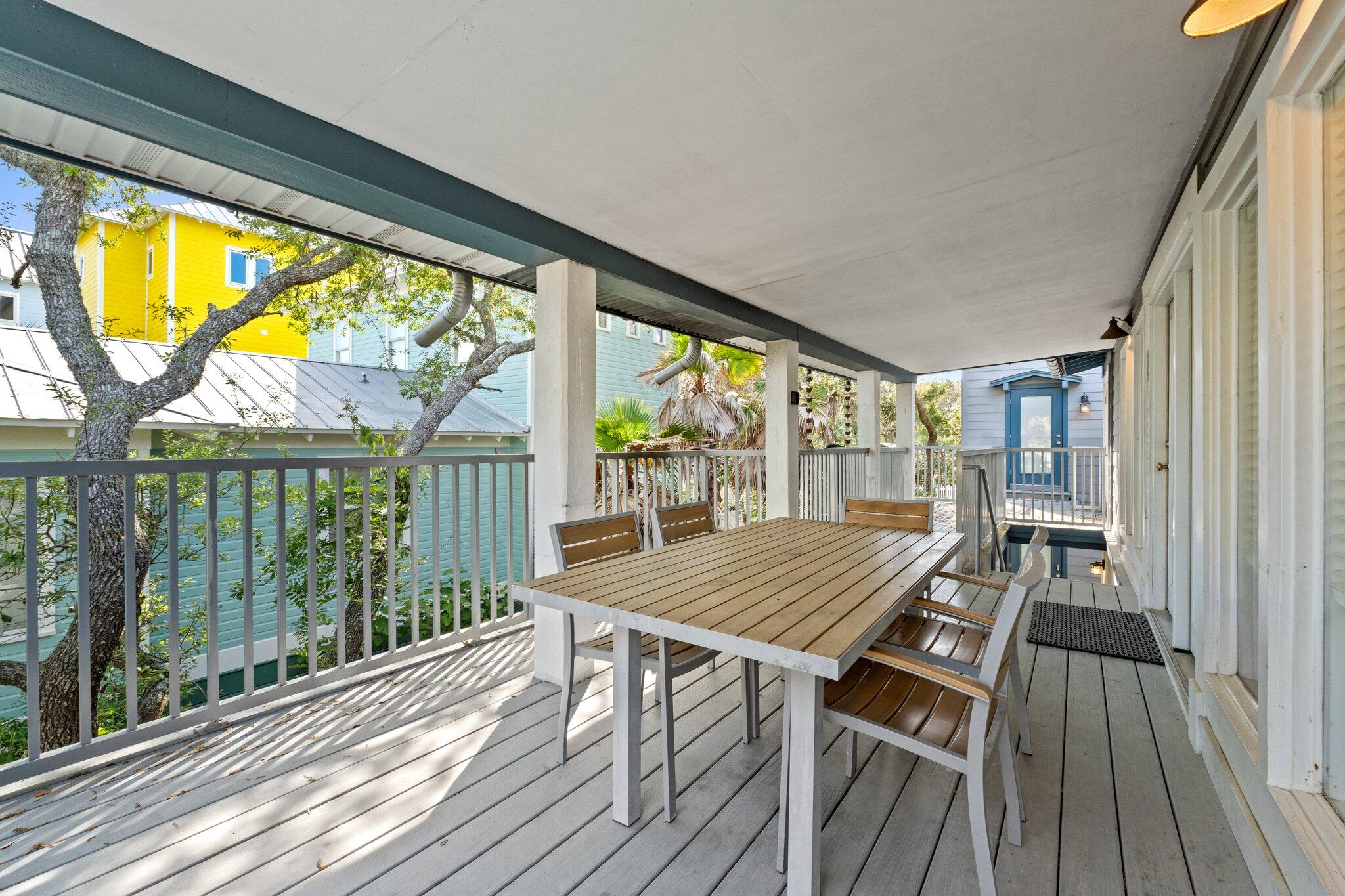 91 Cypress Hill Road Santa Rosa Beach, FL 32459 - Photo 6 of 66 a view of a living room with large windows and wooden floor
