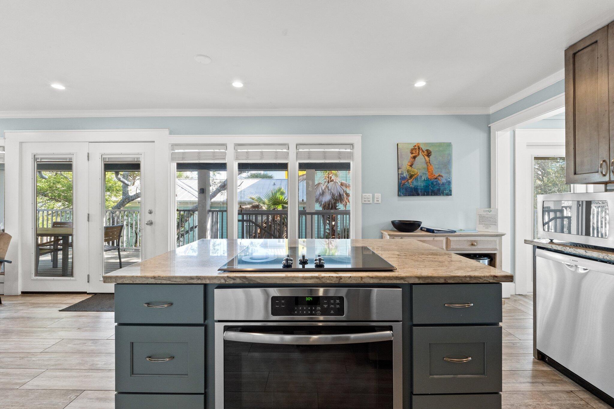 91 Cypress Hill Road Santa Rosa Beach, FL 32459 - Photo 7 of 66 a kitchen with stainless steel appliances granite countertop a stove and a refrigerator
