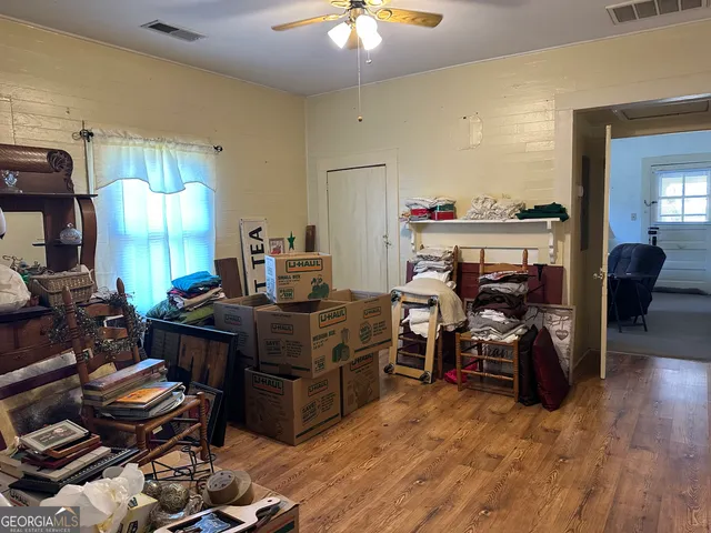 a room with wooden furniture and a chandelier