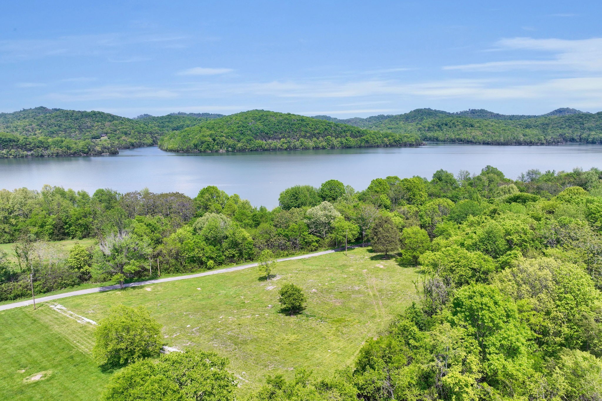 560 Sullivan Bend Road Elmwood, TN 38560 - Photo 1 of 42 a view of a lake with houses in the back