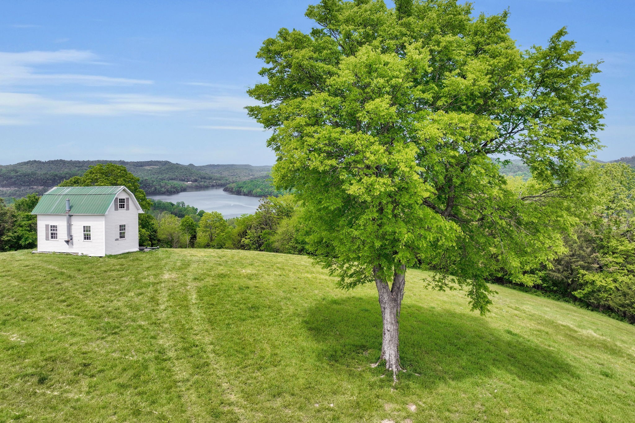 560 Sullivan Bend Road Elmwood, TN 38560 - Photo 12 of 42 a house view with a garden space