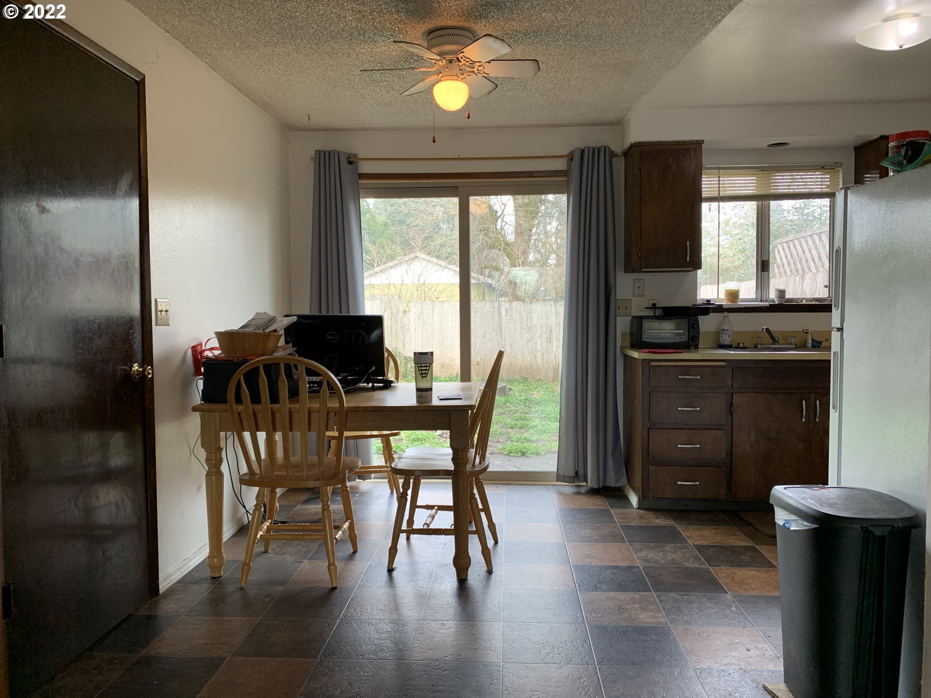 296 South 50th Place Springfield, OR 97478 - Photo 27 of 32 a view of a dining room with furniture window and wooden floor
