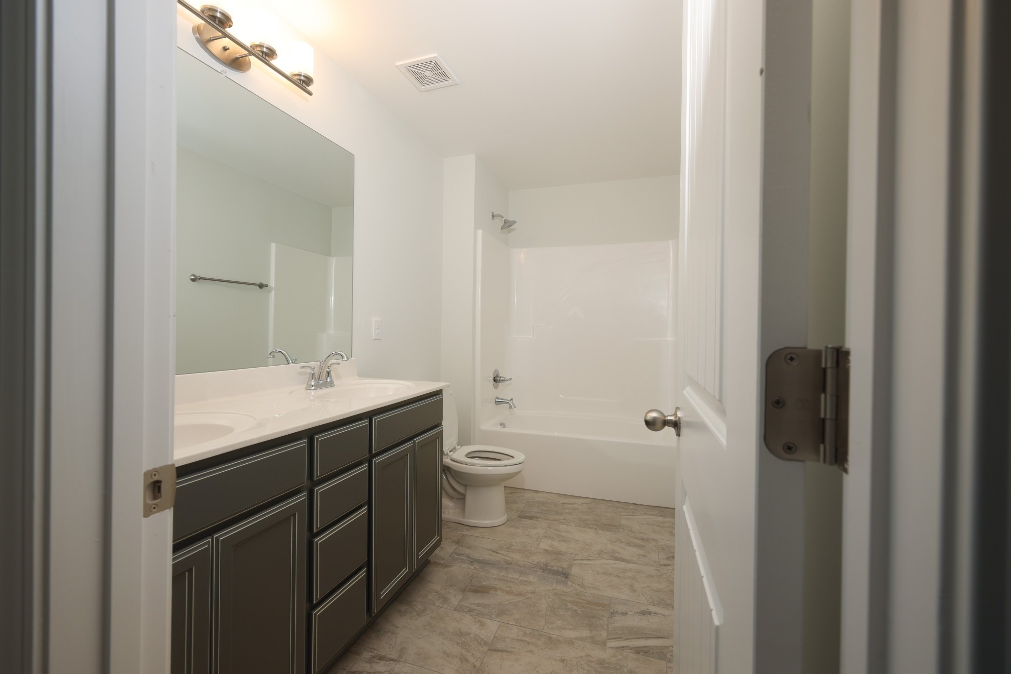 7649 Knobdate Road Smyrna, TN 37167 - Photo 21 of 23 a bathroom with a granite countertop sink toilet and shower