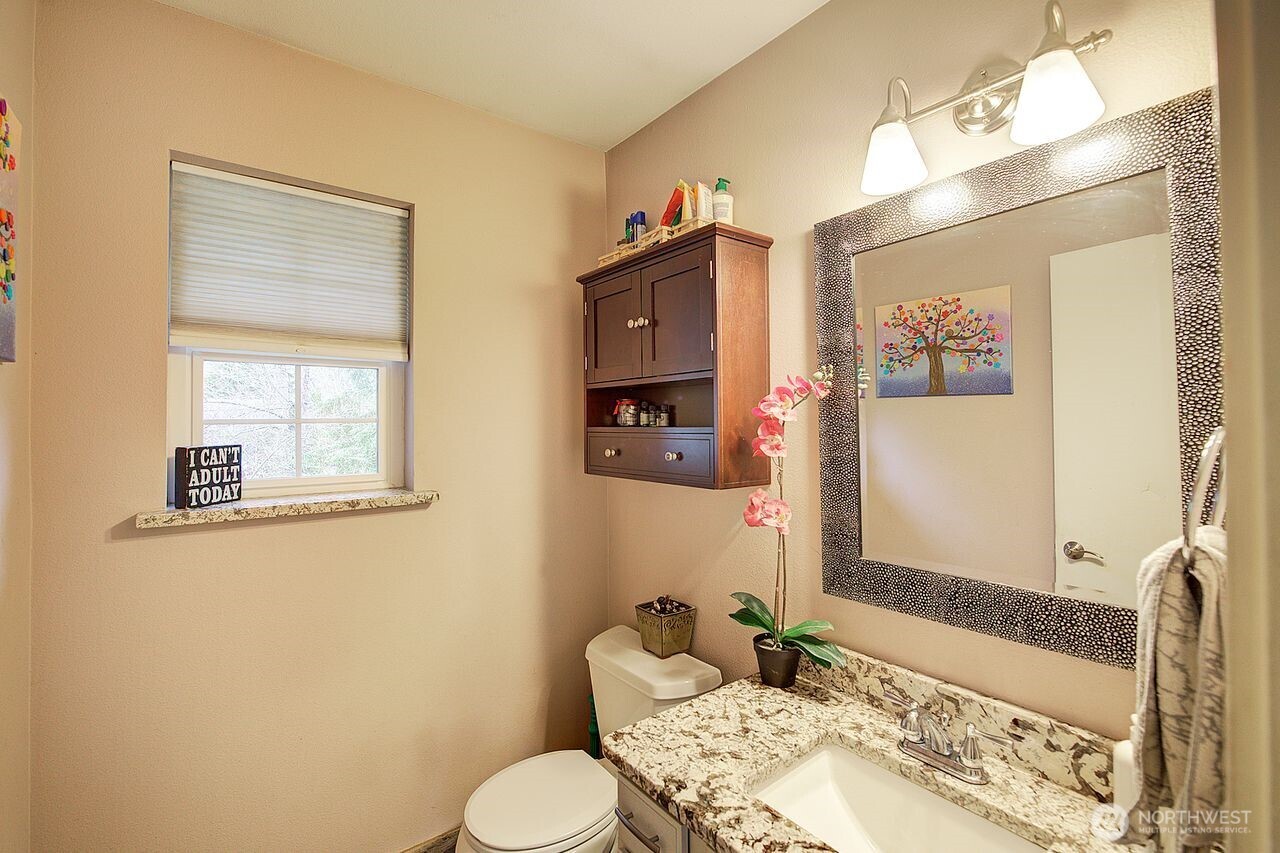 44212 Fir Road Gold Bar, WA 98251 - Photo 14 of 34 a bathroom with a granite countertop sink mirror vanity and toilet