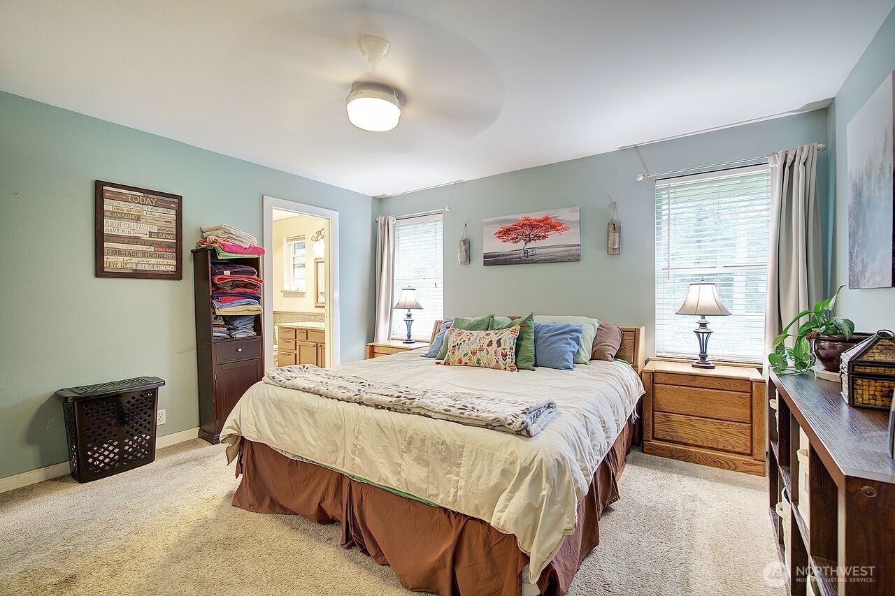 44212 Fir Road Gold Bar, WA 98251 - Photo 19 of 34 a bedroom with a bed a couch and a window