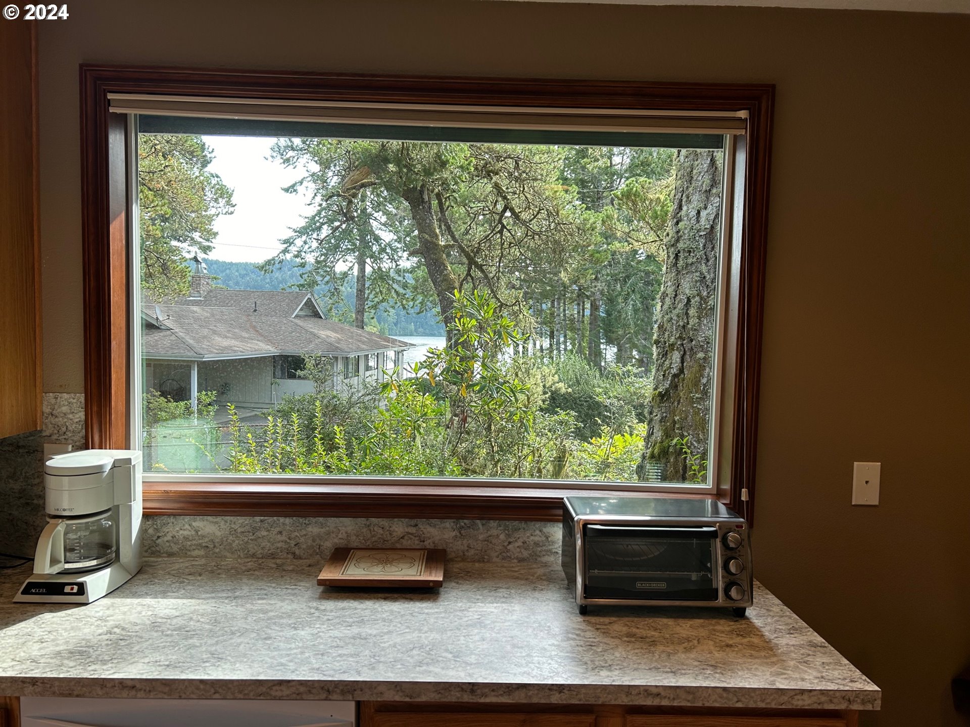 87179 Munsel Lake Road Florence, OR 97439 - Photo 11 of 27 a room with a large window and sitting area