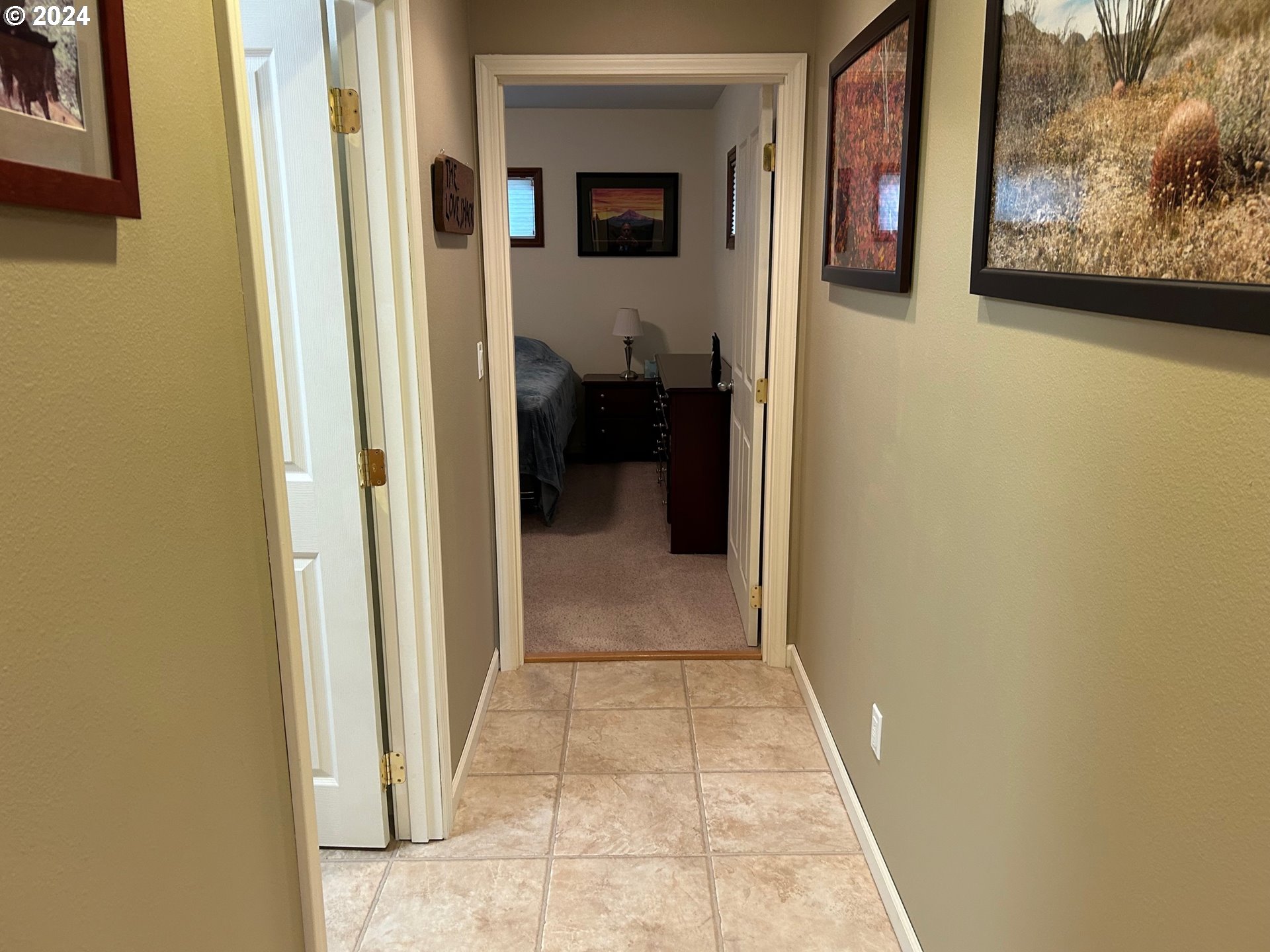 87179 Munsel Lake Road Florence, OR 97439 - Photo 13 of 27 a view of a hallway with wooden floor and a living space