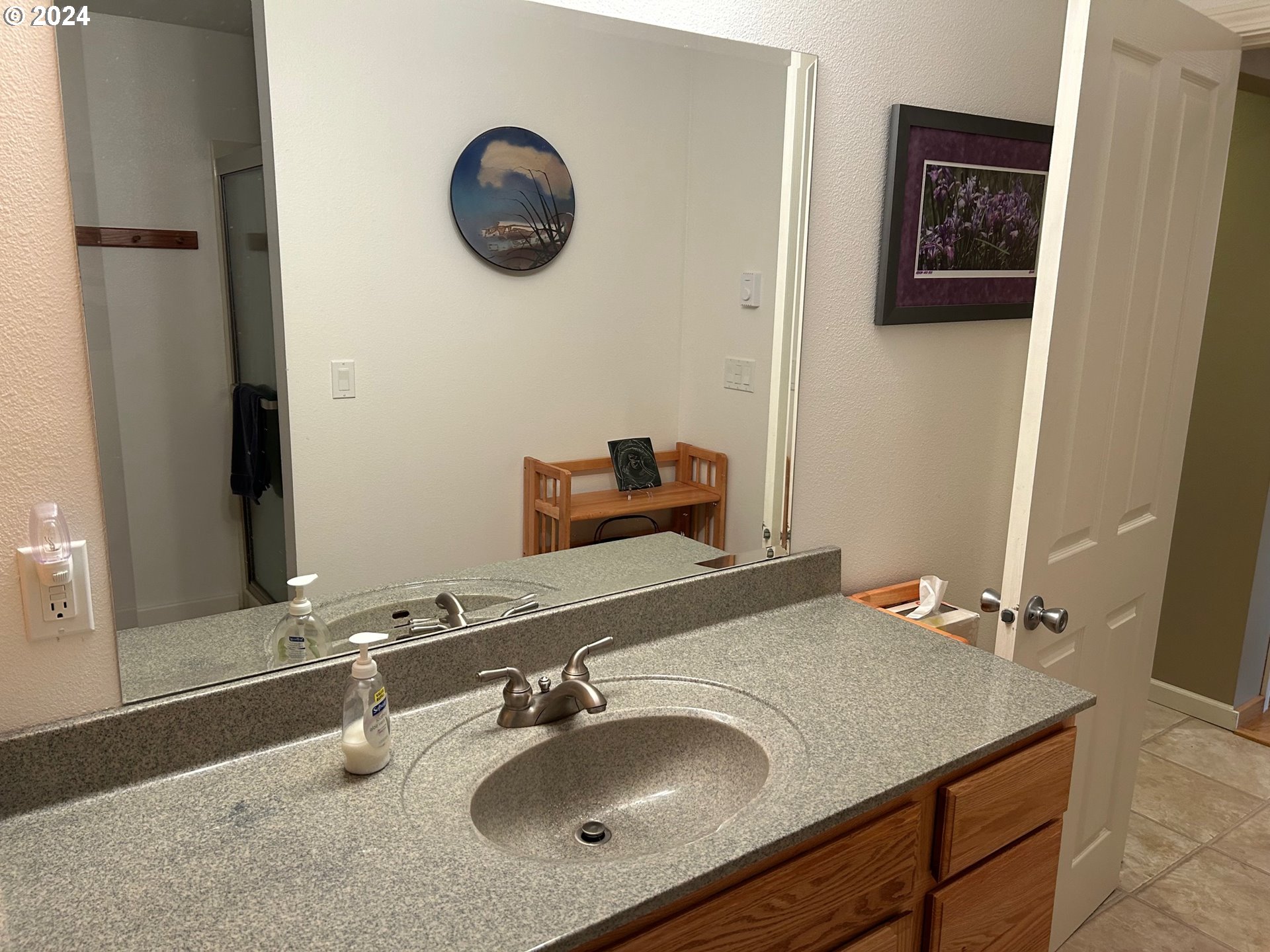 87179 Munsel Lake Road Florence, OR 97439 - Photo 18 of 27 a bathroom with a sink and a mirror