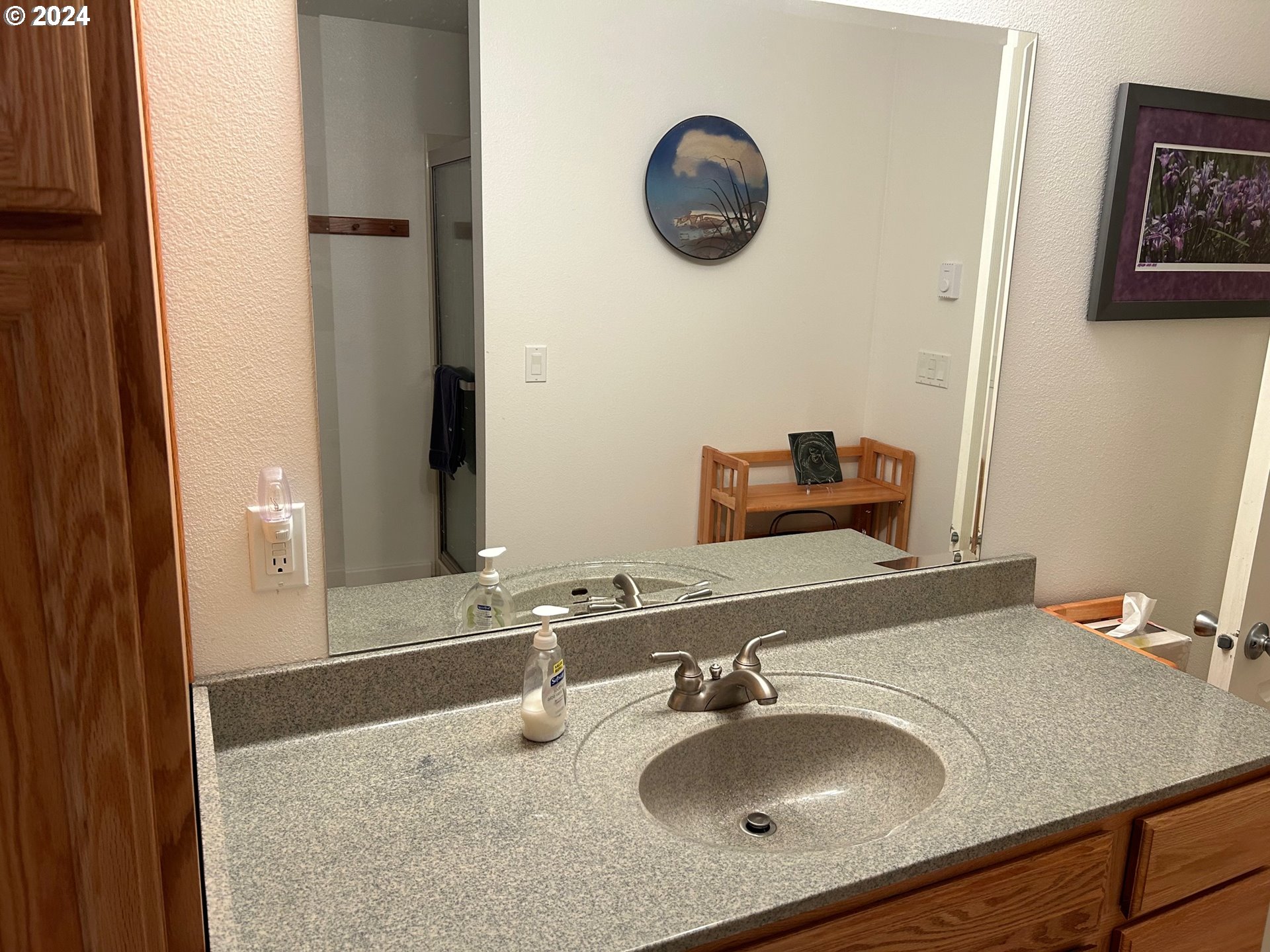 87179 Munsel Lake Road Florence, OR 97439 - Photo 19 of 27 a bathroom with a sink and a mirror