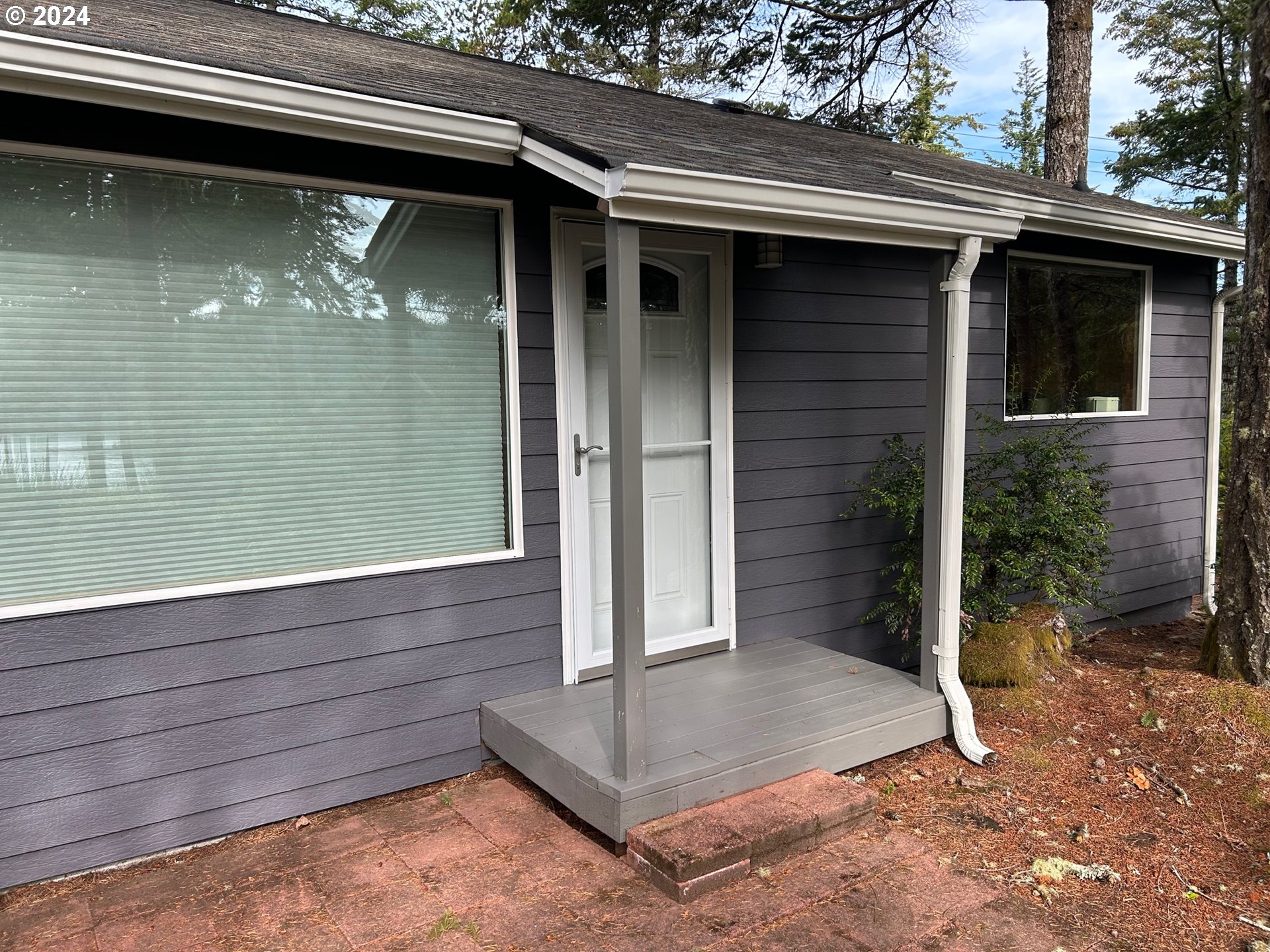 87179 Munsel Lake Road Florence, OR 97439 - Photo 21 of 27 a view of house with a space balcony
