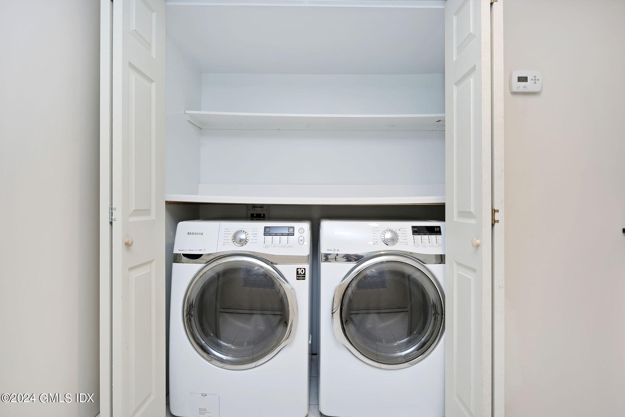 44 Hendrie Avenue Riverside, CT 06878 - Photo 22 of 40 a utility room with dryer and washer