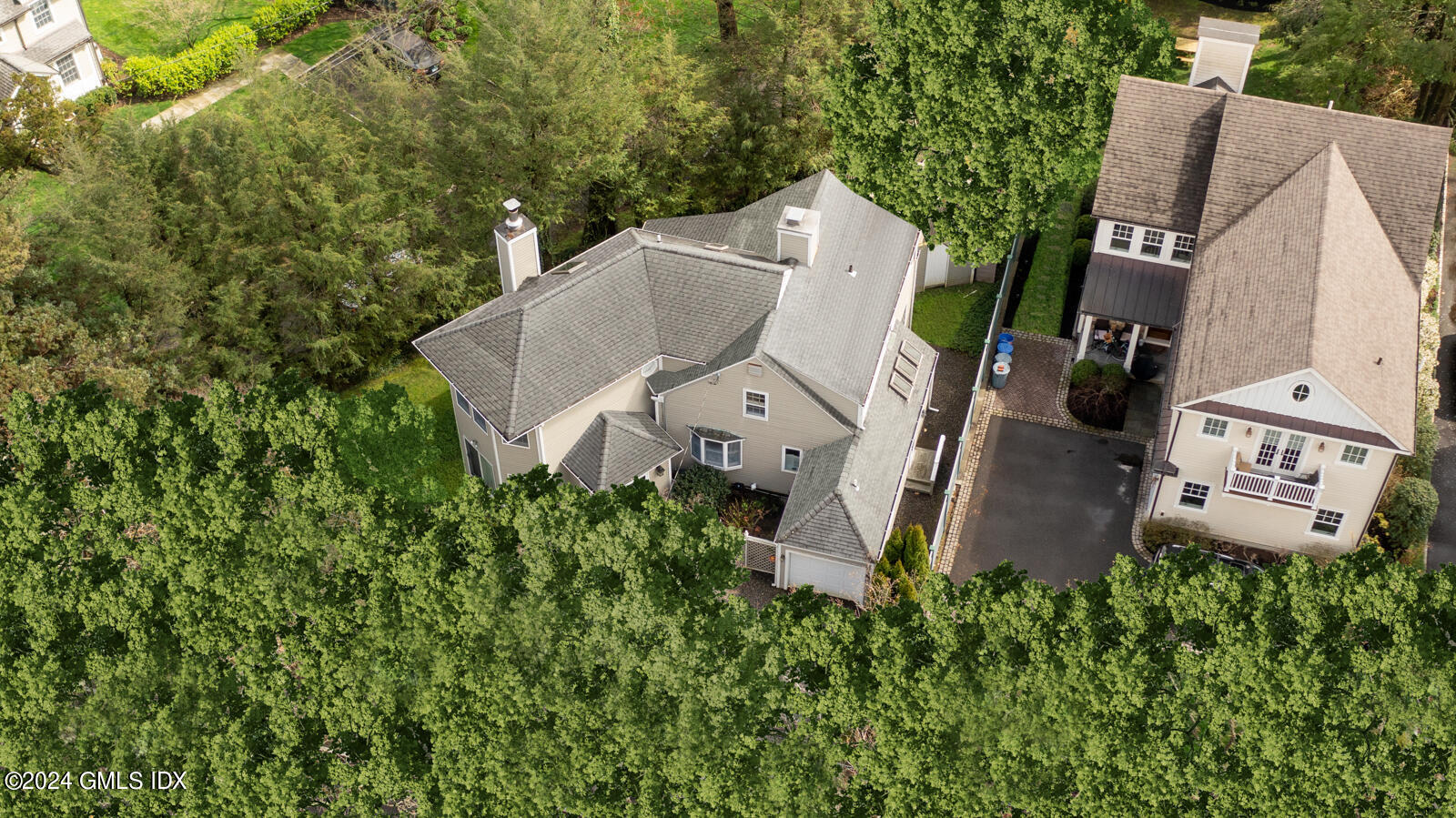 44 Hendrie Avenue Riverside, CT 06878 - Photo 37 of 40 an aerial view of a house with outdoor space and trees all around