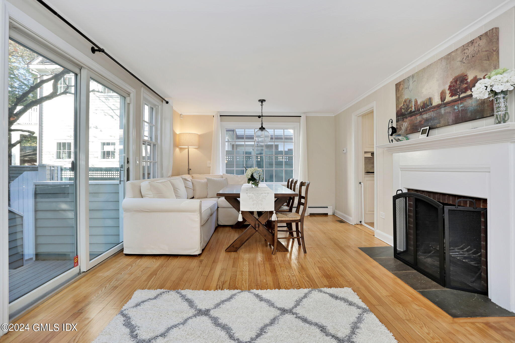 44 Hendrie Avenue Riverside, CT 06878 - Photo 10 of 40 a living room with furniture a fireplace and a table