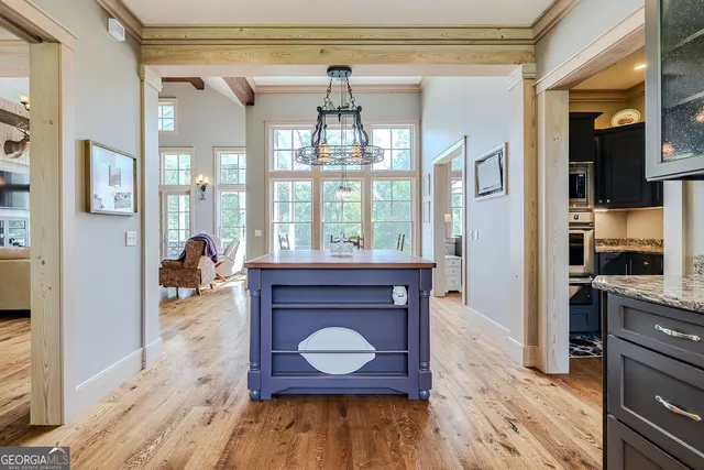 a bed room with a bed window and a flat screen tv