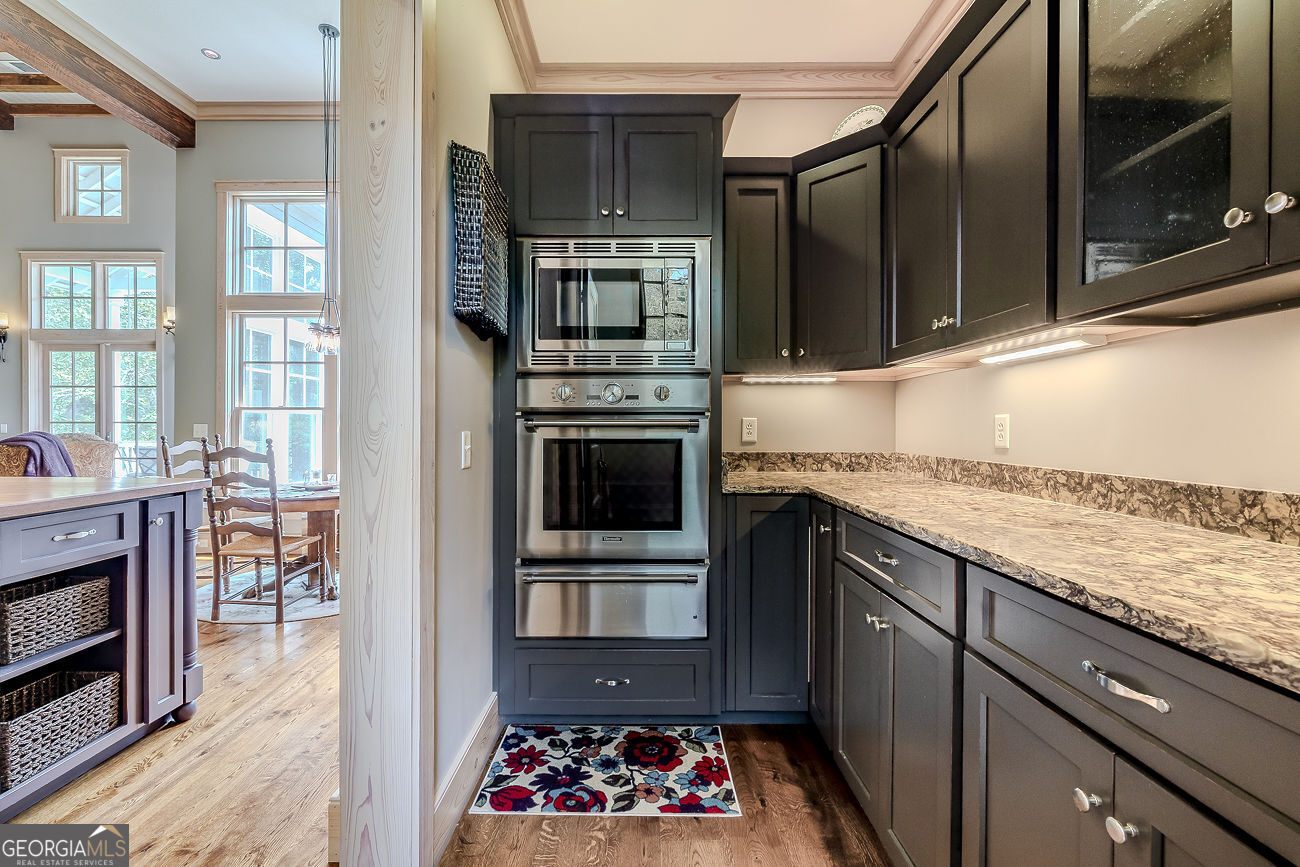 165 Shearouse Landing Brooklet, GA 30415 - Photo 19 of 78 a kitchen with stainless steel appliances granite countertop a stove microwave and refrigerator