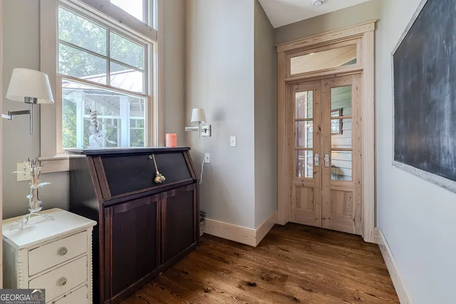 a spacious bathroom with a tub shower and window