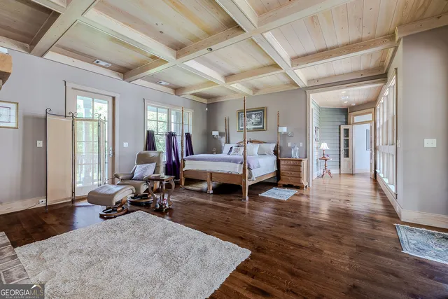 a view of a bedroom with a bed and furniture