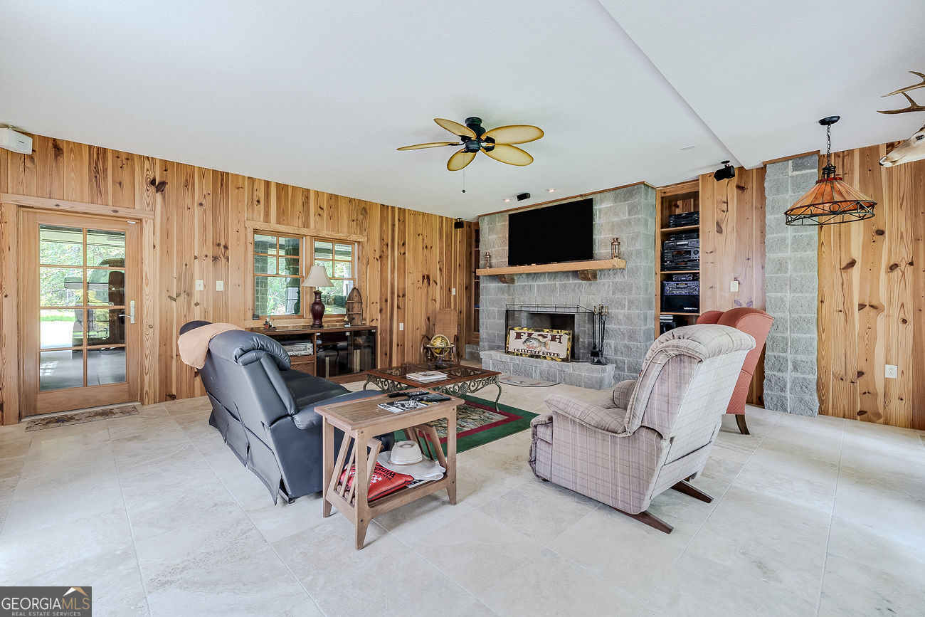 165 Shearouse Landing Brooklet, GA 30415 - Photo 51 of 78 a living room with furniture fireplace and a flat screen tv