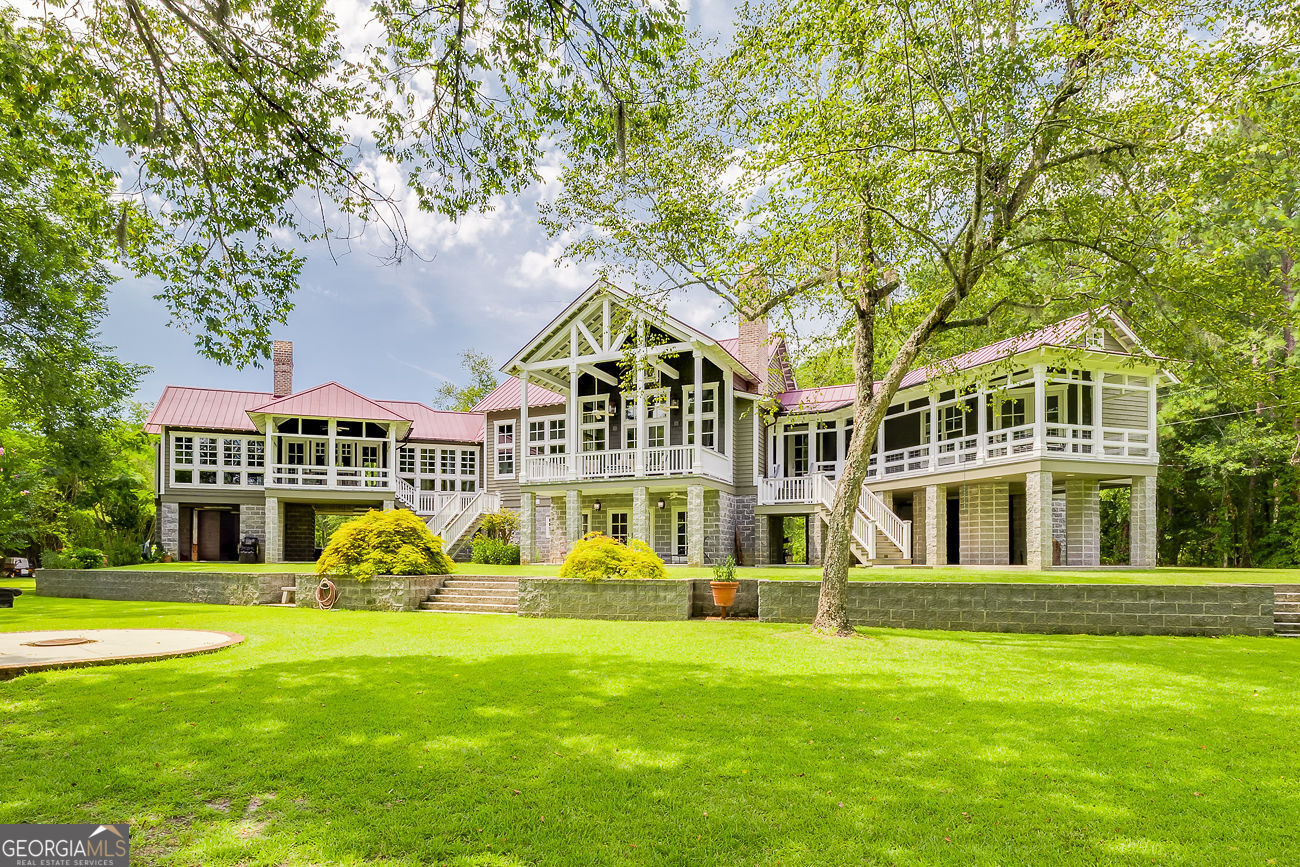 165 Shearouse Landing Brooklet, GA 30415 - Photo 57 of 78 a front view of a house with a garden