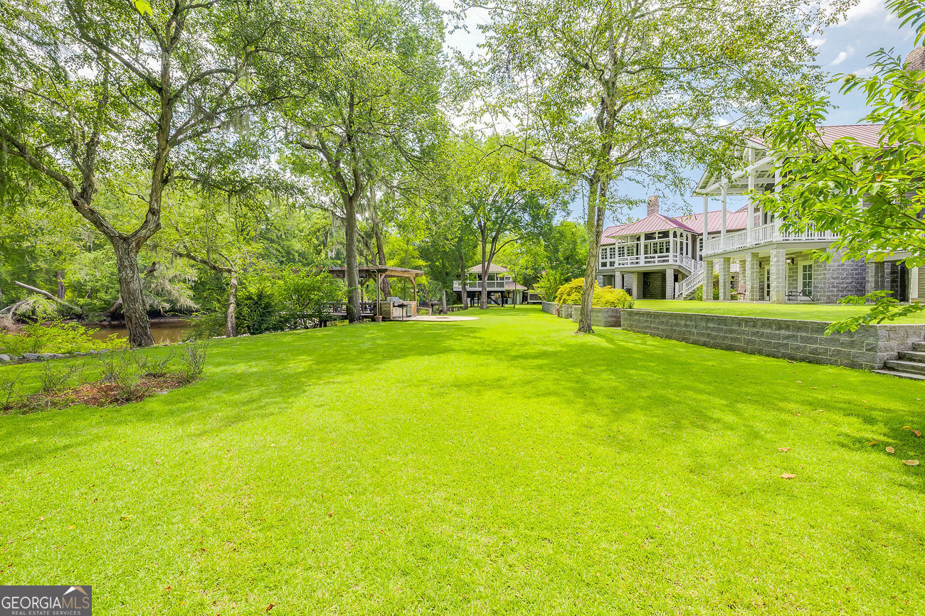 165 Shearouse Landing Brooklet, GA 30415 - Photo 58 of 78 a front view of a house with a yard