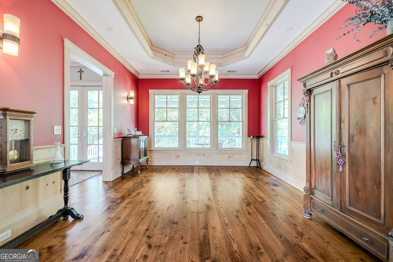 165 Shearouse Landing Brooklet, GA 30415 - Photo 6 of 78 a view of an empty room with wooden floor and a window