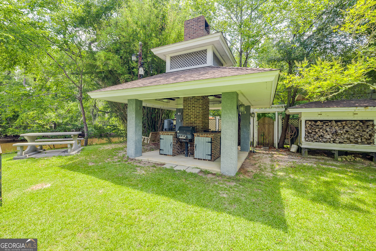165 Shearouse Landing Brooklet, GA 30415 - Photo 63 of 78 a view of a house with a yard porch and sitting area