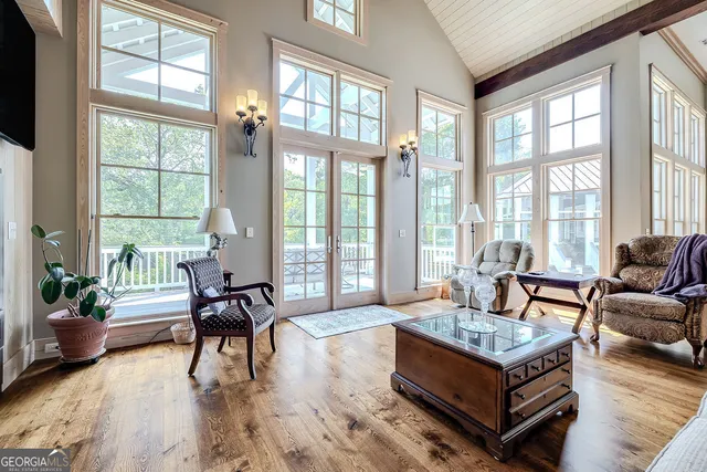 a living room with fireplace furniture and a flat screen tv