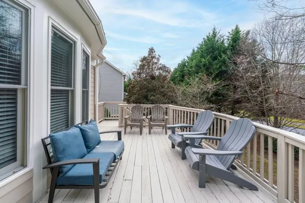 a front view of house with yard swimming pool and outdoor seating
