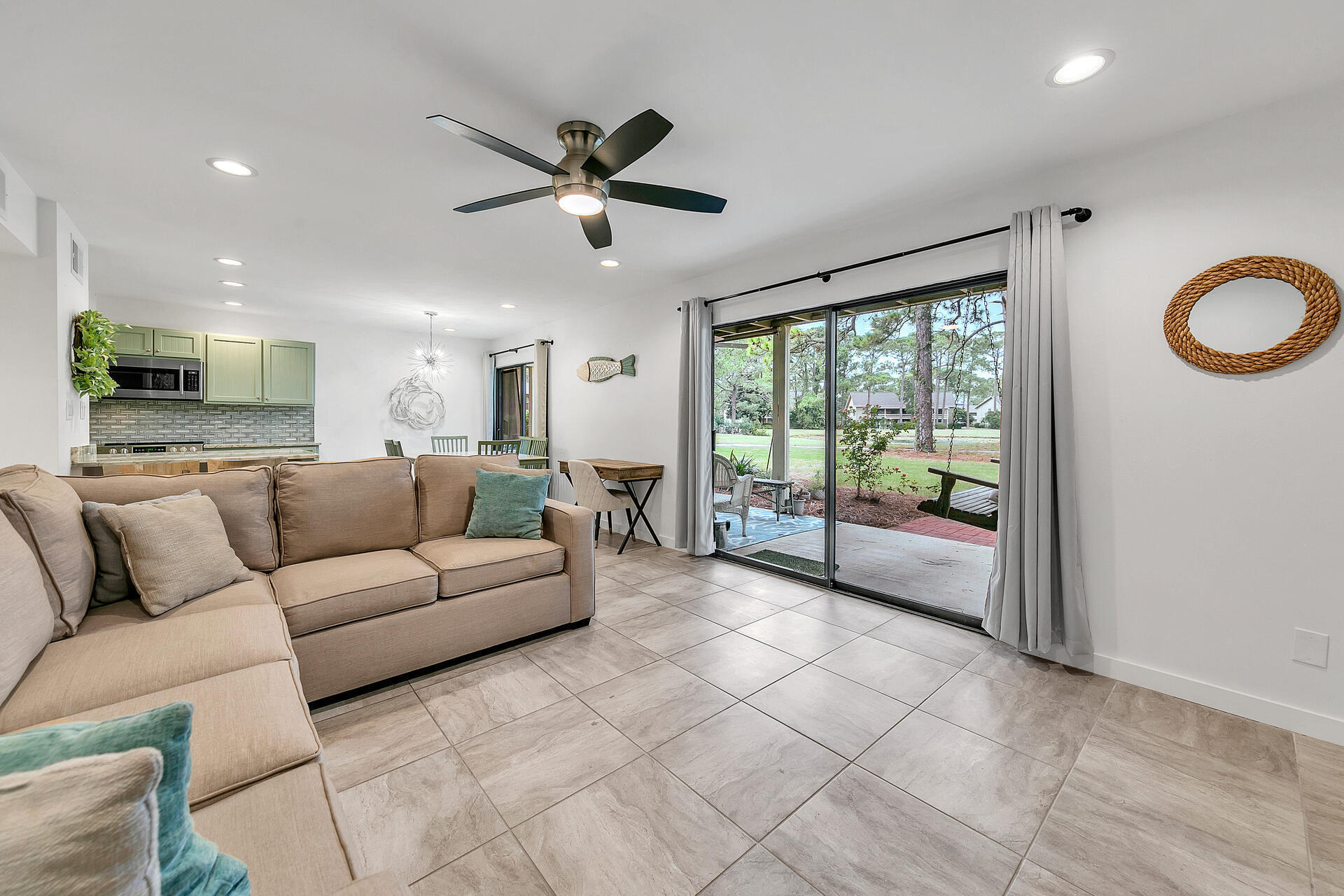 277 Sunset Bay, Unit 27A Miramar Beach, FL 32550 - Photo 17 of 42 a living room with furniture and a large window