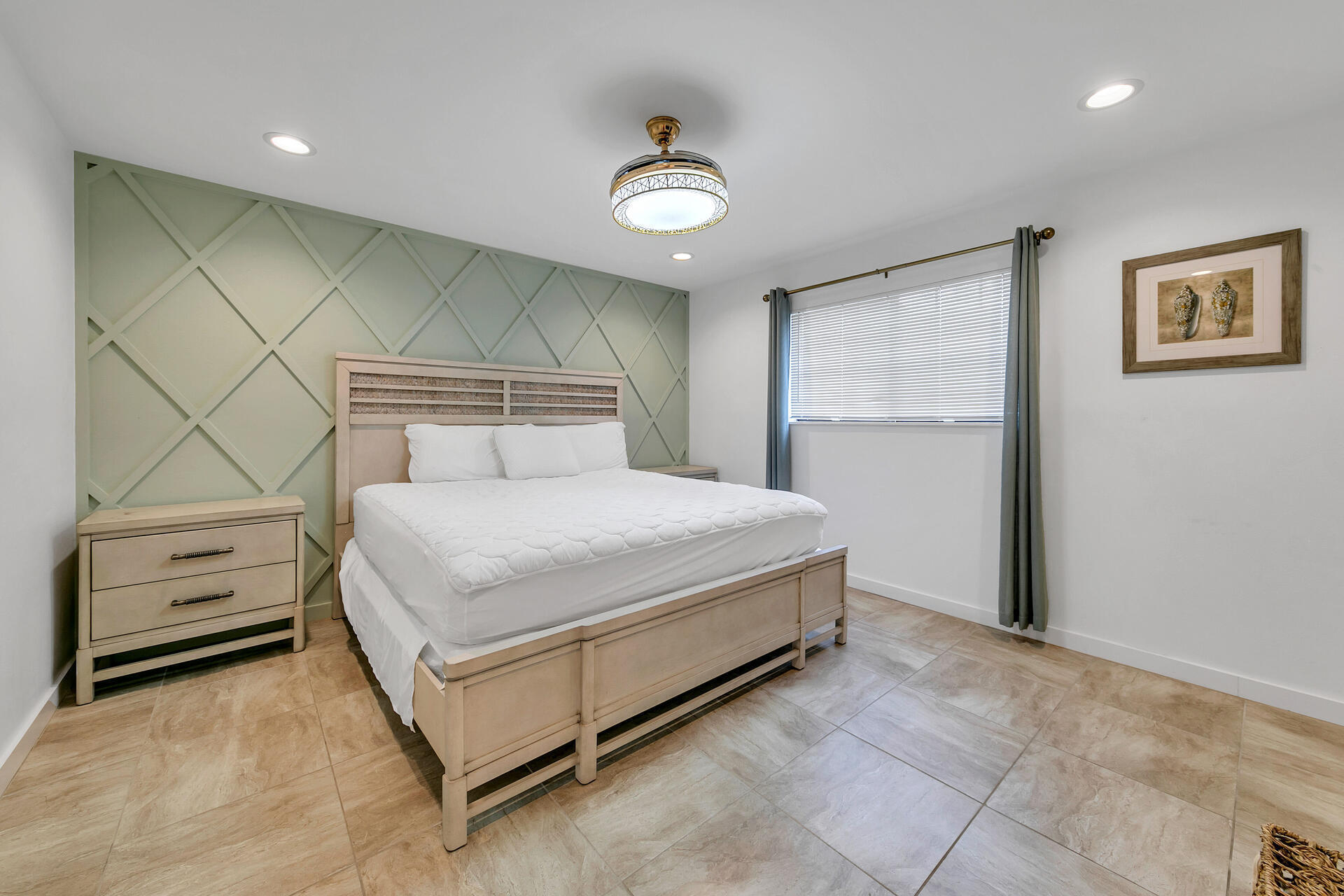 277 Sunset Bay, Unit 27A Miramar Beach, FL 32550 - Photo 18 of 42 a bedroom with a bed and a ceiling fan