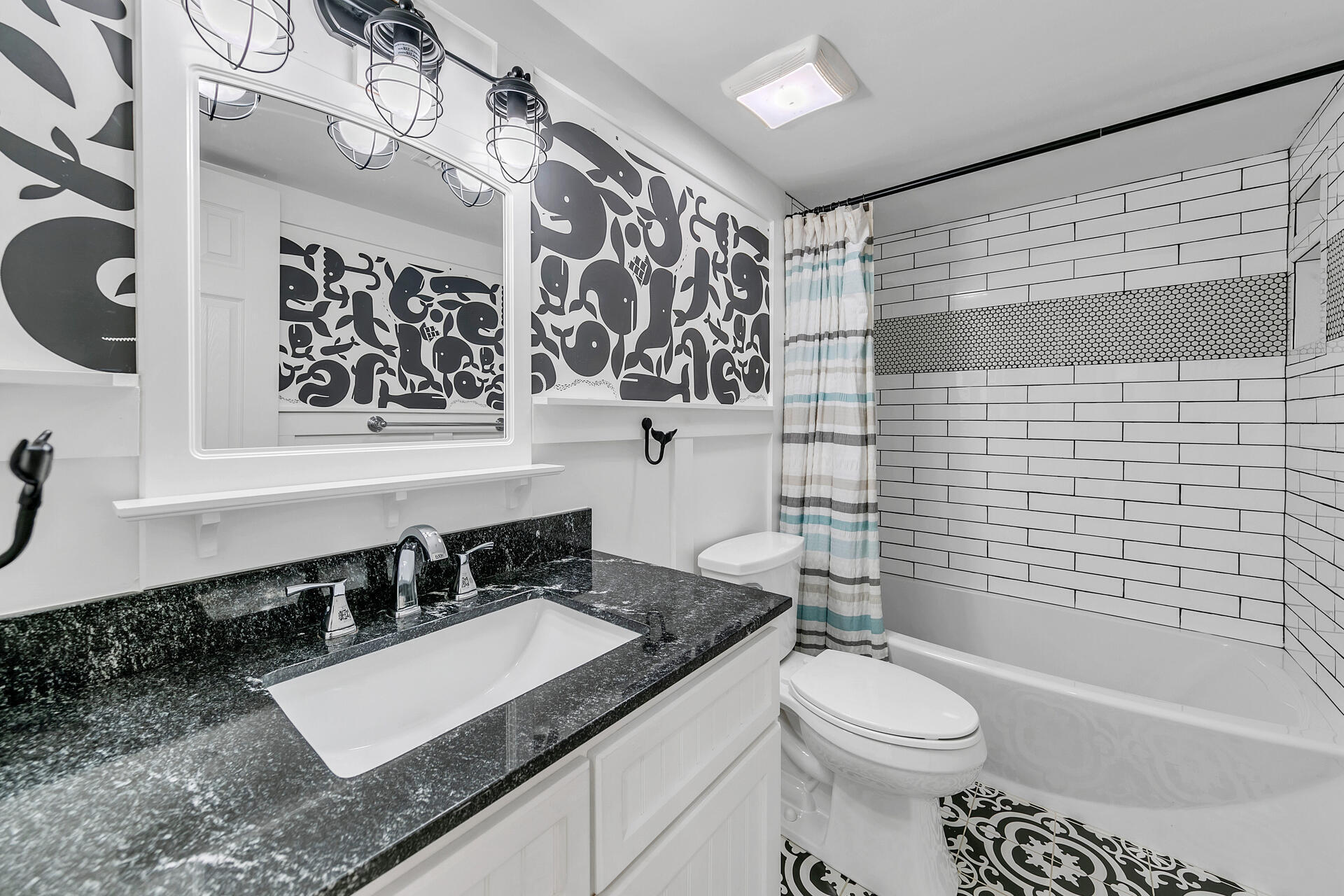 277 Sunset Bay, Unit 27A Miramar Beach, FL 32550 - Photo 27 of 42 a bathroom with a granite countertop sink toilet and shower
