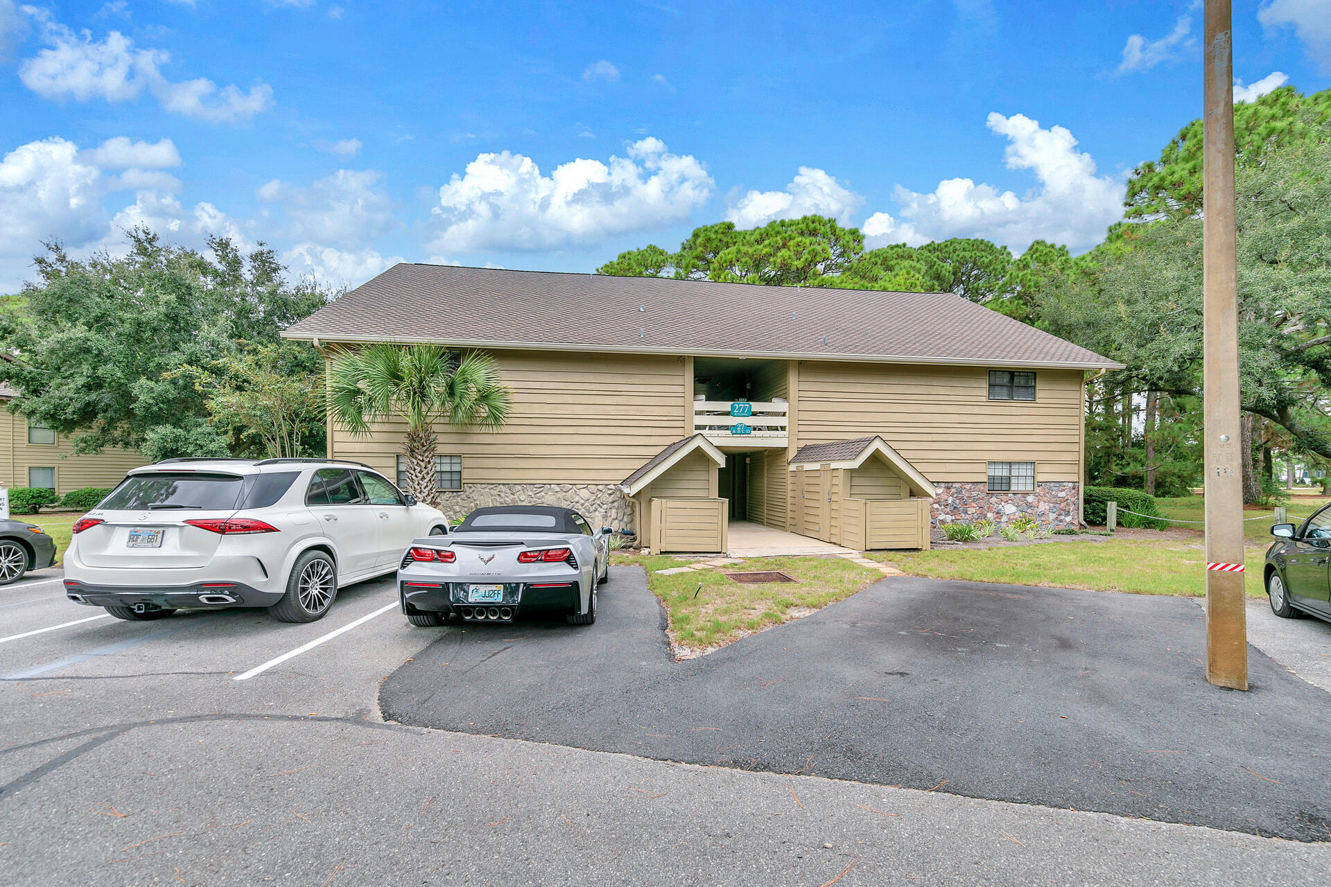277 Sunset Bay, Unit 27A Miramar Beach, FL 32550 - Photo 28 of 42 a front view of a house with cars parked