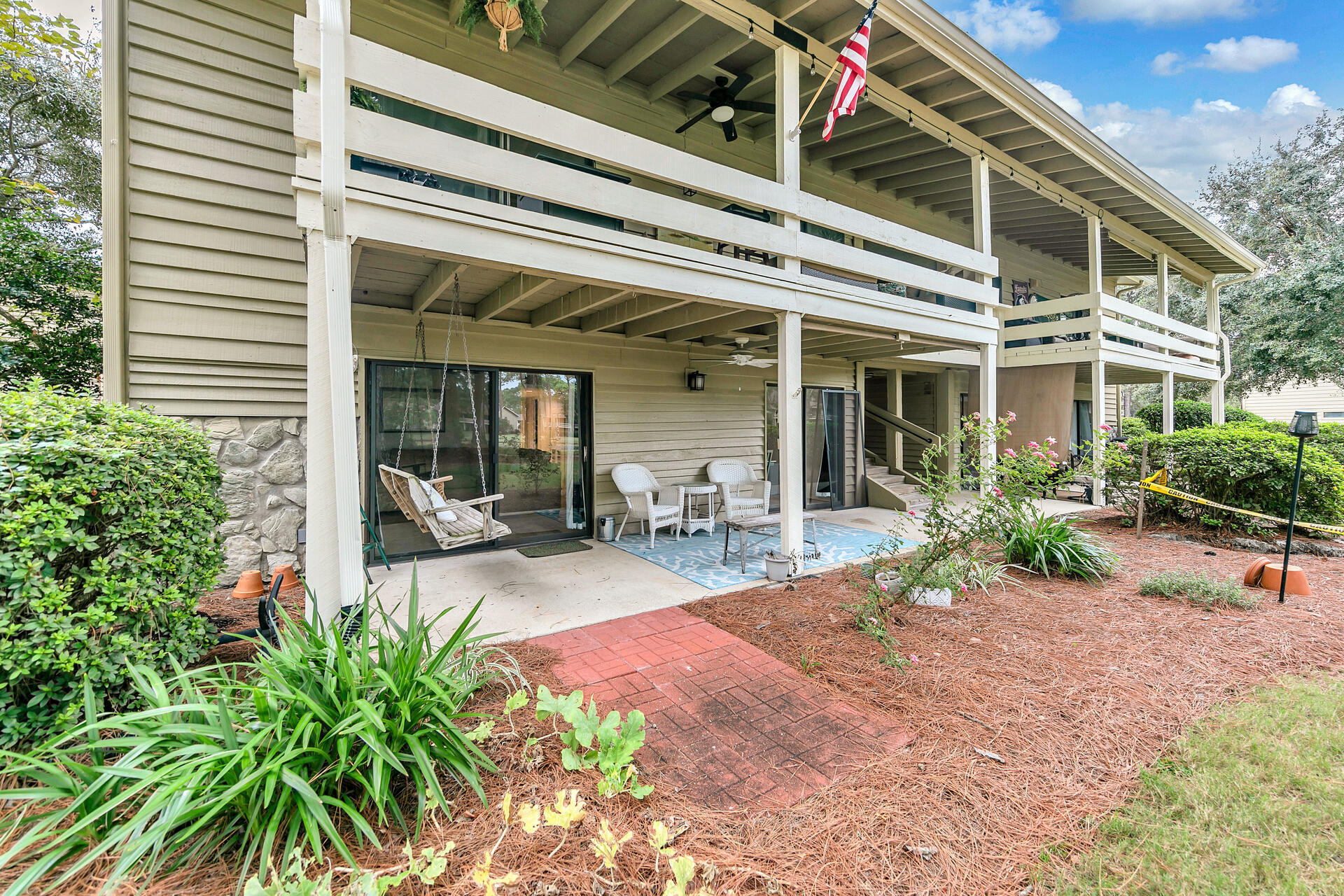 277 Sunset Bay, Unit 27A Miramar Beach, FL 32550 - Photo 31 of 42 a view of a house with backyard porch and sitting area