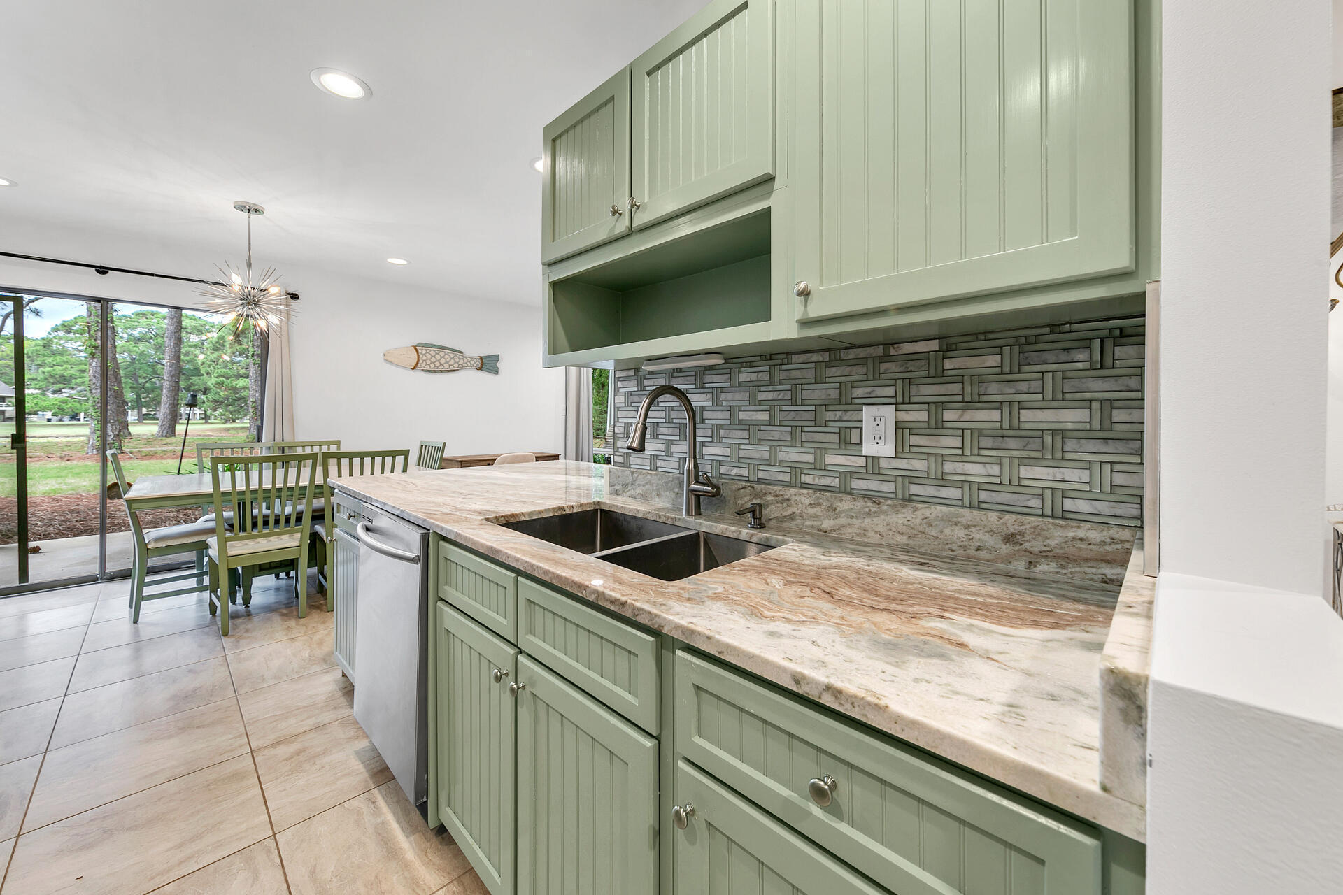277 Sunset Bay, Unit 27A Miramar Beach, FL 32550 - Photo 8 of 42 a kitchen with a sink and cabinets