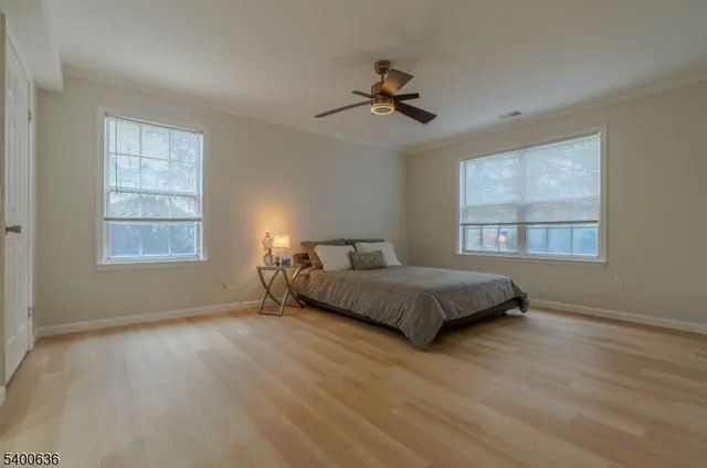 a bathroom with a granite countertop bathtub shower sink and toilet