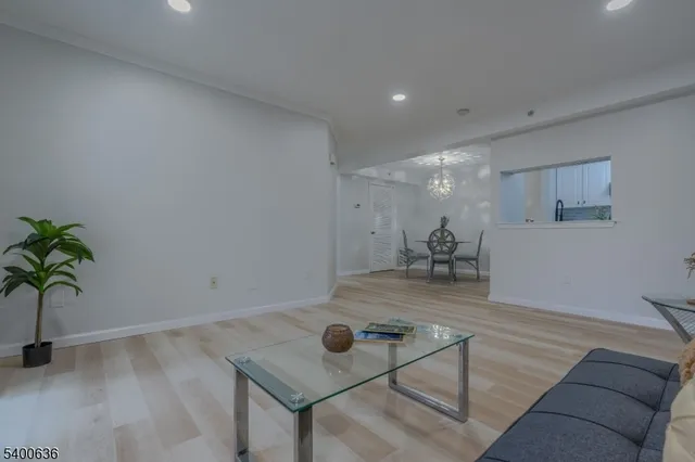 a view of room with furniture and wooden floor