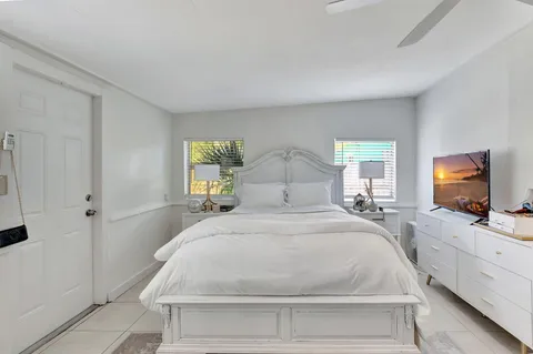 a large white bed in a white room
