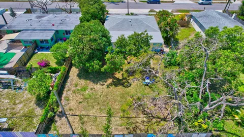 an aerial view of residential house with outdoor space