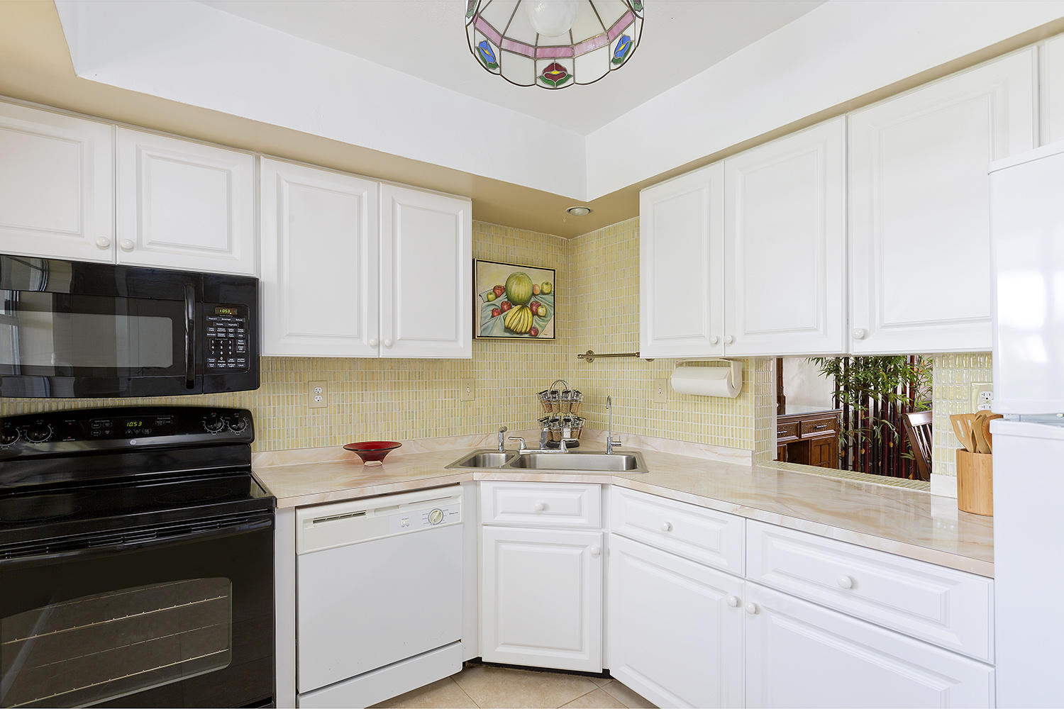 20 Southeast 13th Street, Unit C1 Boca Raton, FL 33432 - Photo 1 of 19 a kitchen with white cabinets and white appliances