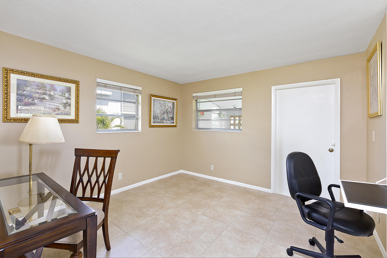 20 Southeast 13th Street, Unit C1 Boca Raton, FL 33432 - Photo 12 of 19 a workspace with a couch and a window