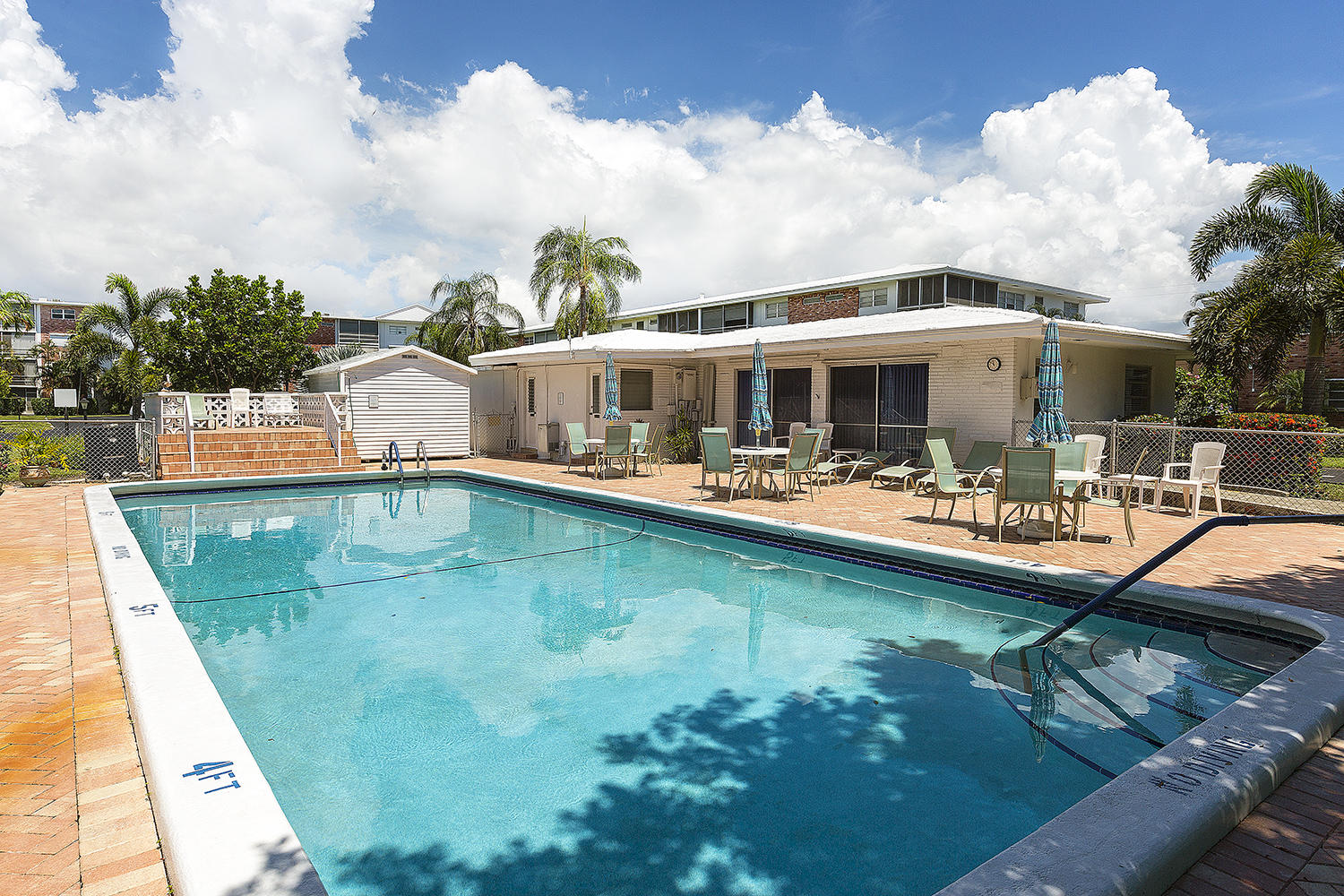 20 Southeast 13th Street, Unit C1 Boca Raton, FL 33432 - Photo 15 of 19 a view of a swimming pool with outdoor seating