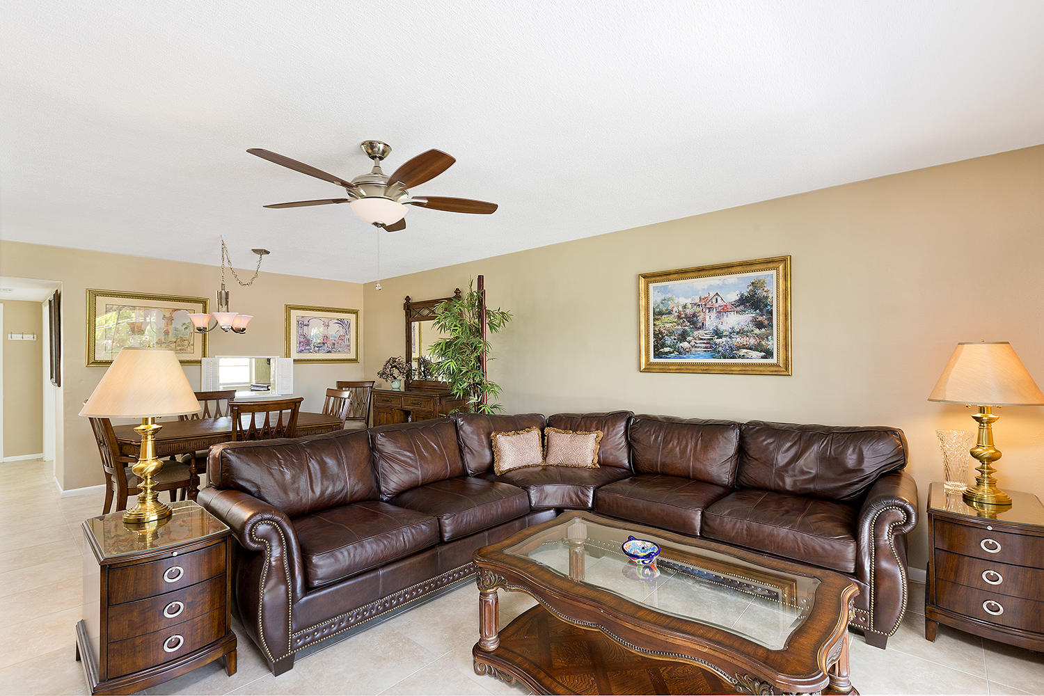 20 Southeast 13th Street, Unit C1 Boca Raton, FL 33432 - Photo 6 of 19 a living room with furniture a couch and a chandelier