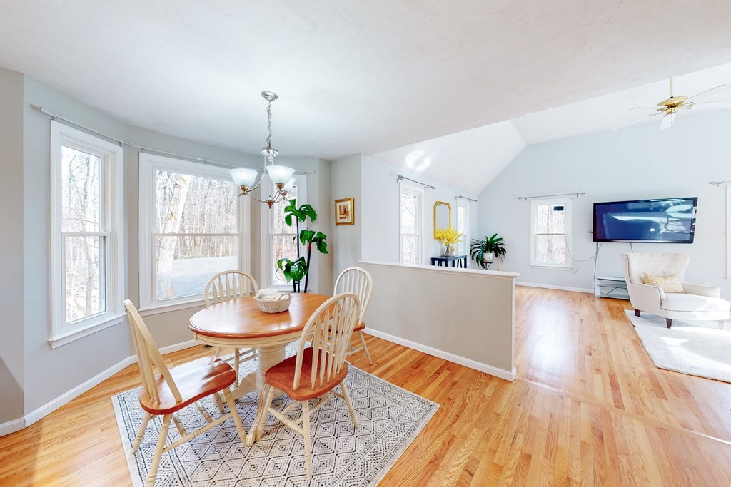 1107 Liberty Square Road Boxborough, MA 01719 - Photo 8 of 33 a living room with dining table and wooden floor