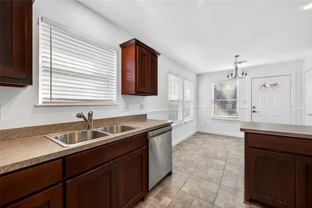 a kitchen with a sink and cabinets