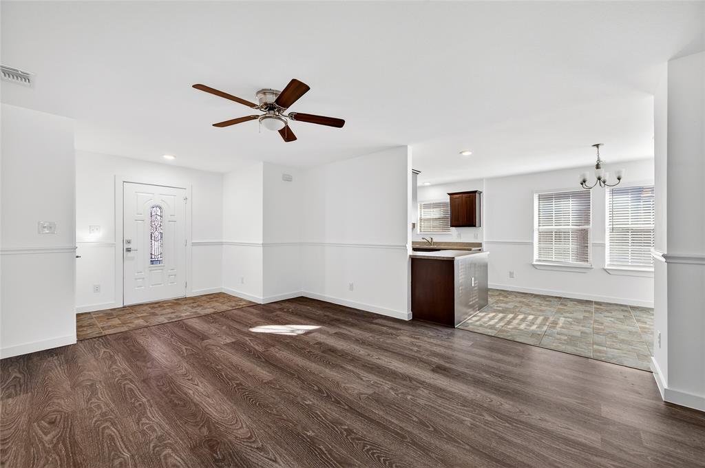 704 East Sycamore Street Sherman, TX 75090 - Photo 6 of 32 a view of a kitchen with wooden floor and a kitchen