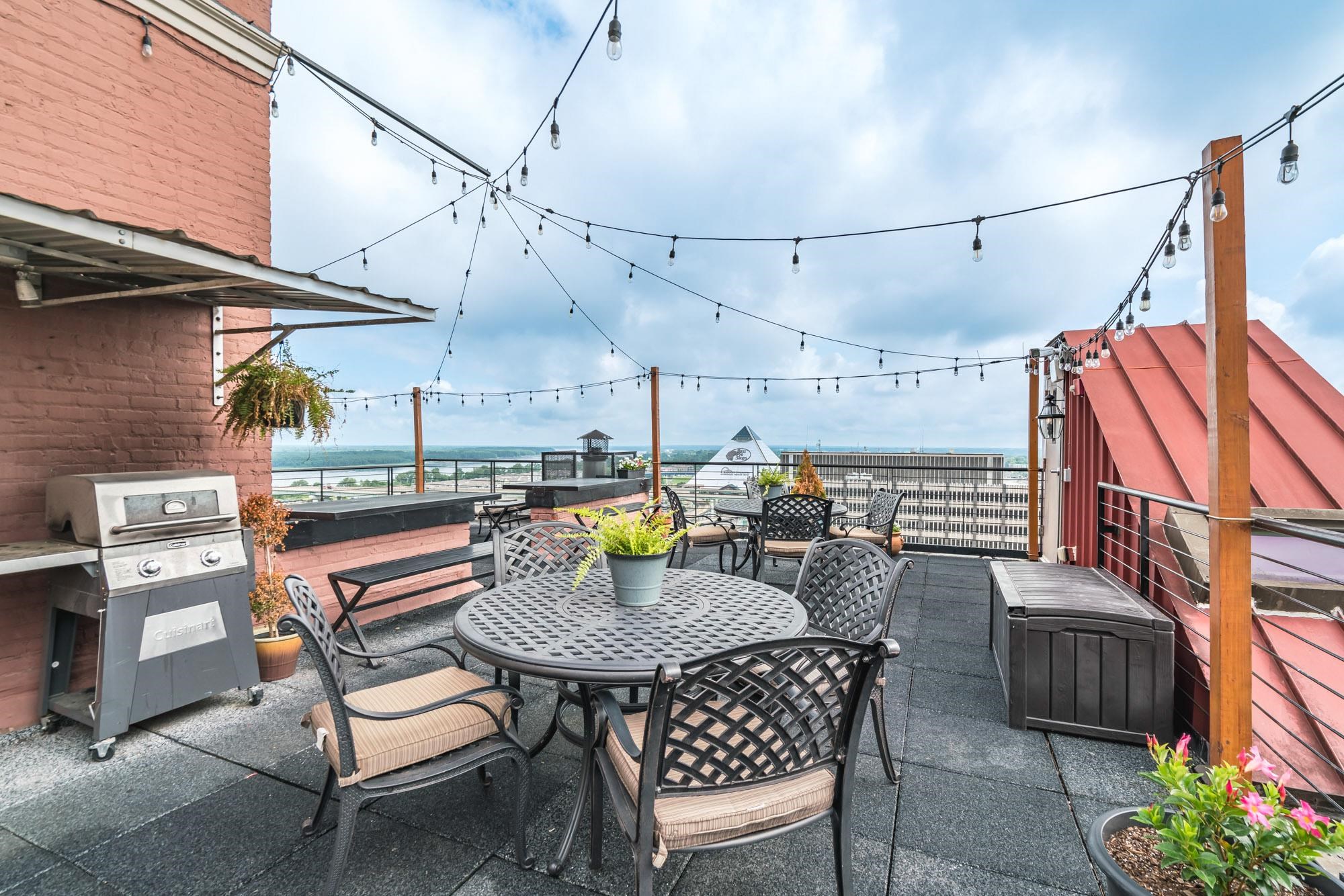109 North Main Street, Unit 908 Memphis, TN 38103 - Photo 20 of 22 a view of a chairs and table in a patio
