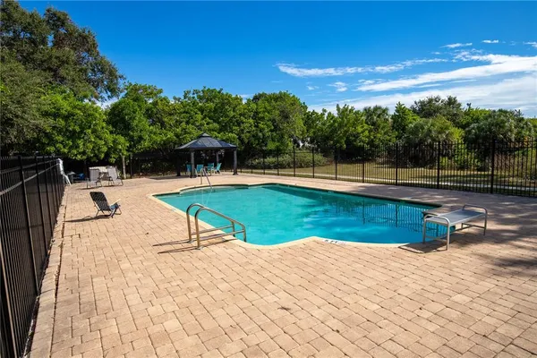 a view of swimming pool with lounge chair
